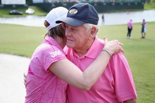 Golf legend Jack Nicklaus embraces former Swedish player Annika Sorenstam at an exhibition tournament